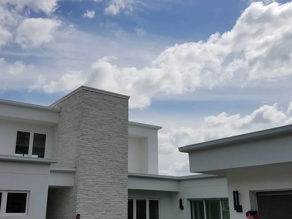 White stone tower flat roof stucco fascia gutters cloudy sky, Sanford